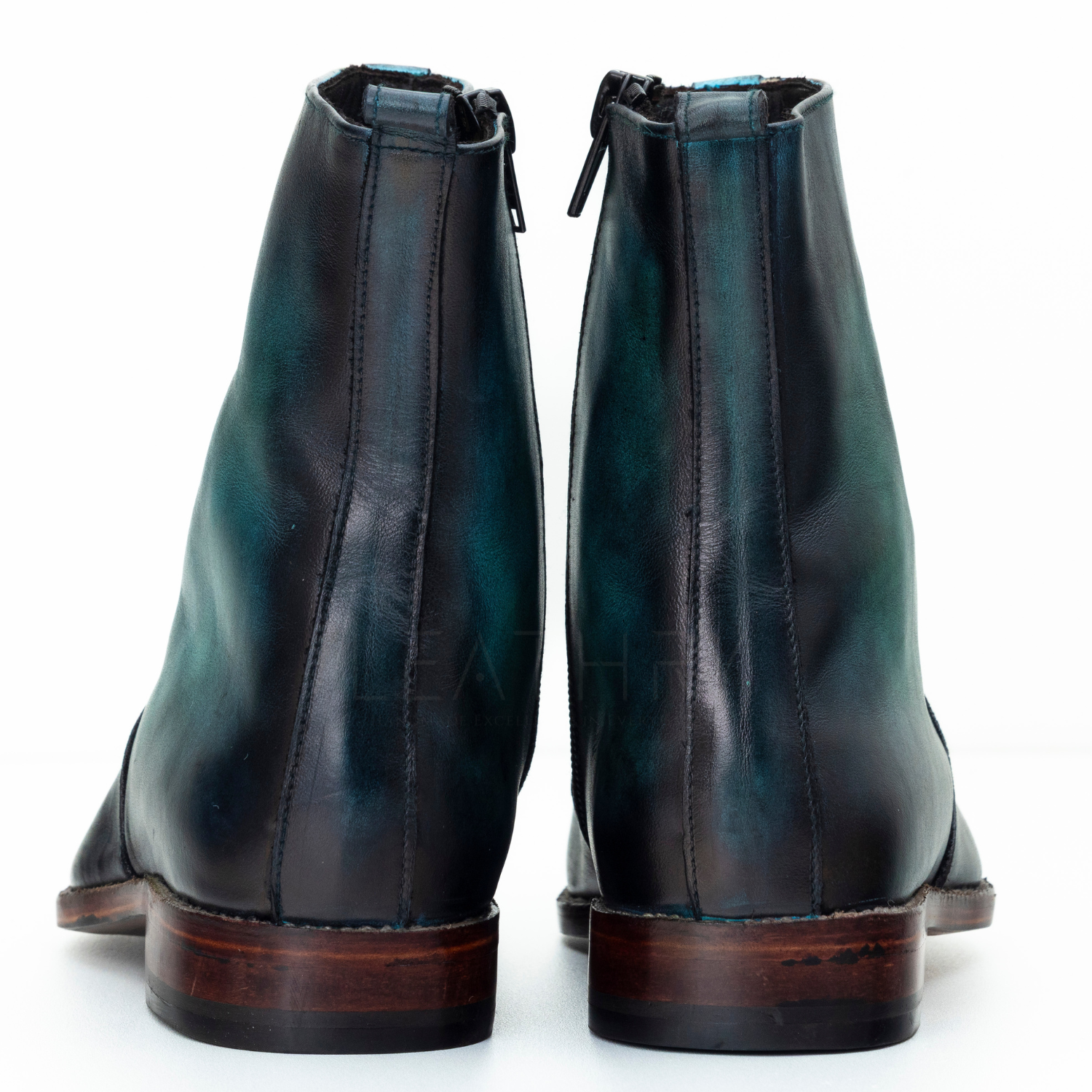 Pair of black leather boots on a white background