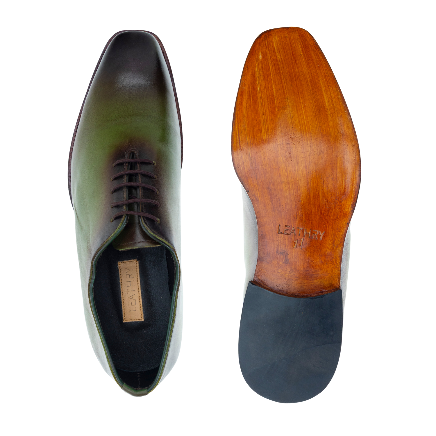 Green leather shoe with wooden insole on a white background