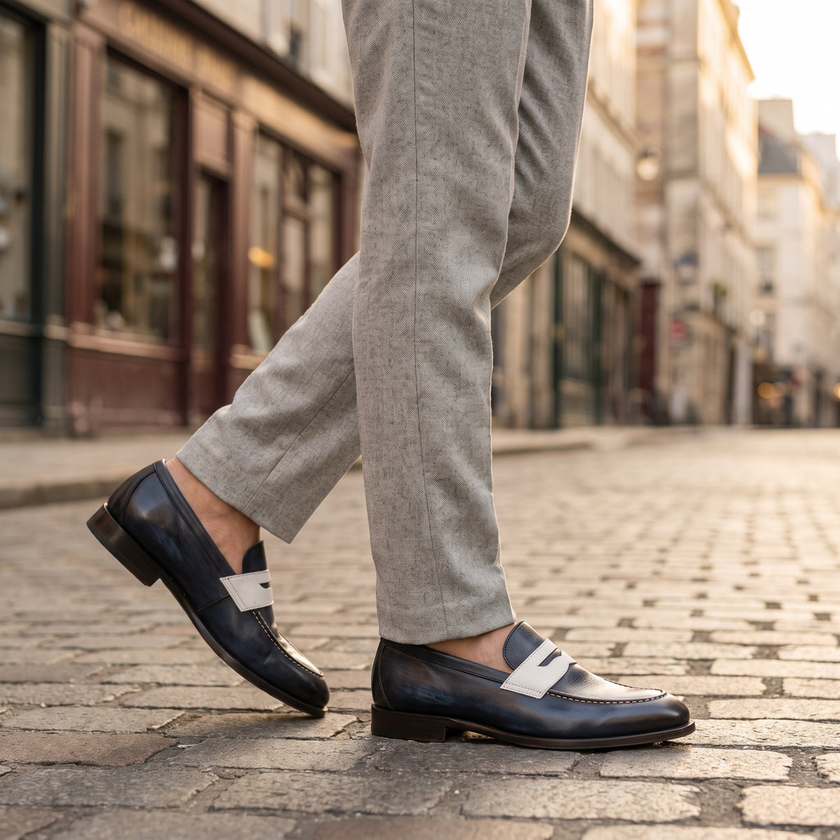 The Sloane men's loafer in navy calf leather, styled editorial photo