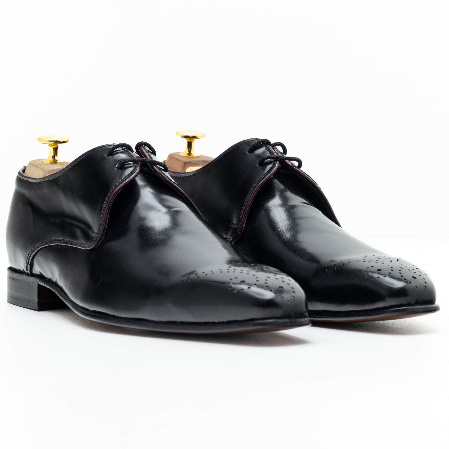 Pair of black dress shoes on a white background