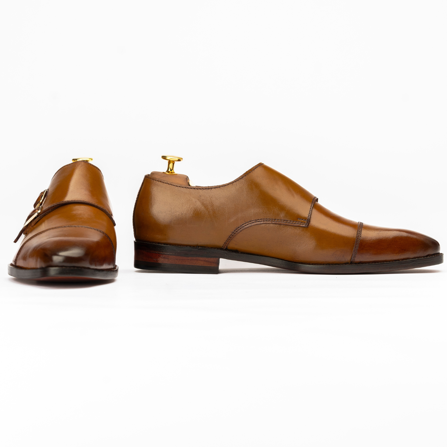 Pair of brown leather shoes on a white background