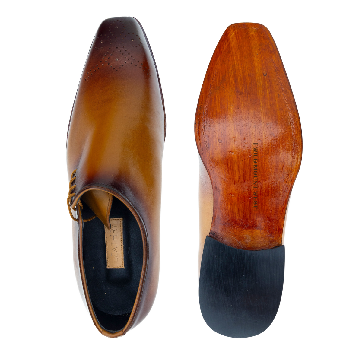 Brown leather shoe with sole showing brand name on a white background