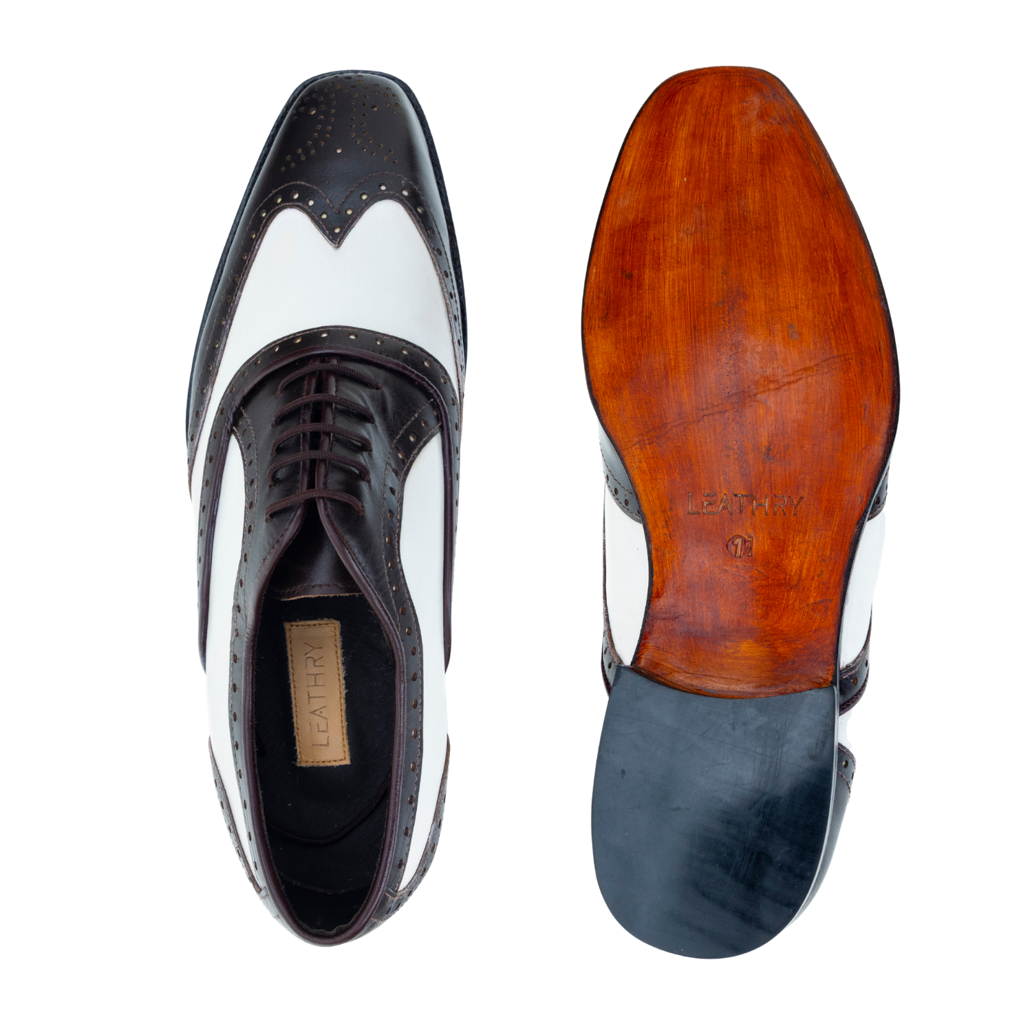 Black and white leather shoe with a wooden sole on a white background