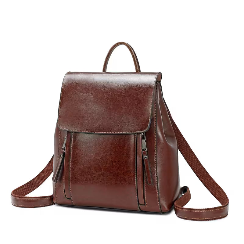 Brown leather backpack on a white background